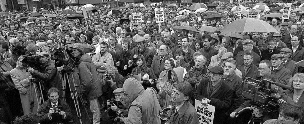 An anti-violence demonstration from 1993 in Belfast city centre. Photograph by Kevin Cooper, the project explores the importance of civil society to the Northern Ireland peace process