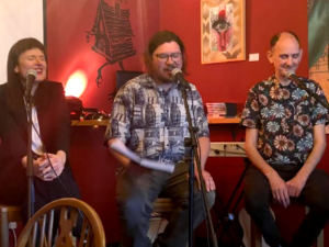 Panel discussion at 'Songwriters in Conversation #2: Collaboration and Community,' Richard O'Brien interviews local songwriters, Bridie Jackson of Staithe, and Pete Dale from Milky Wimpshake. Baba Yaga's Loft, April 2025. Photo by Jenny Alderson