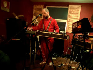 NOVYI LEF band member Thomas Reah performing - photo by Jenny Alderson