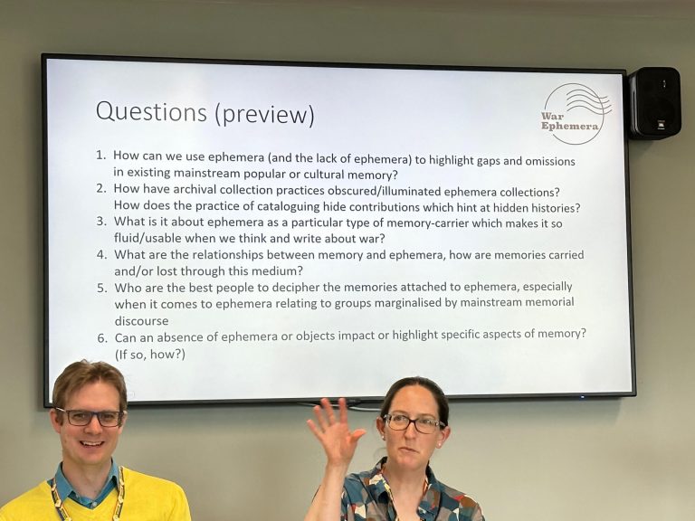 Chris Kempshall and Ann-Marie Einhaus pictured in front of slide with project research questions